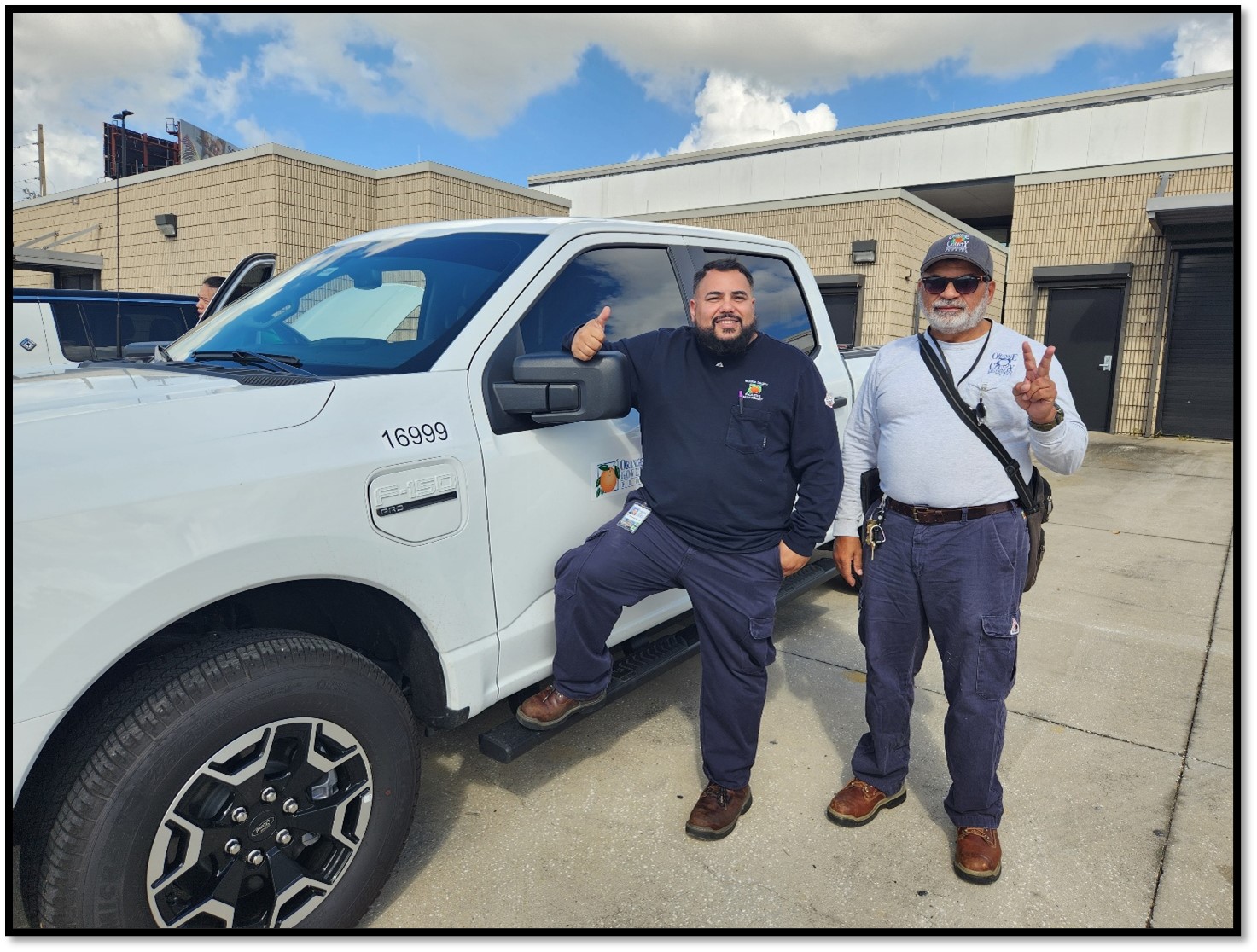 Orange County employees test driving an F-150 Lightning fleet vehicle