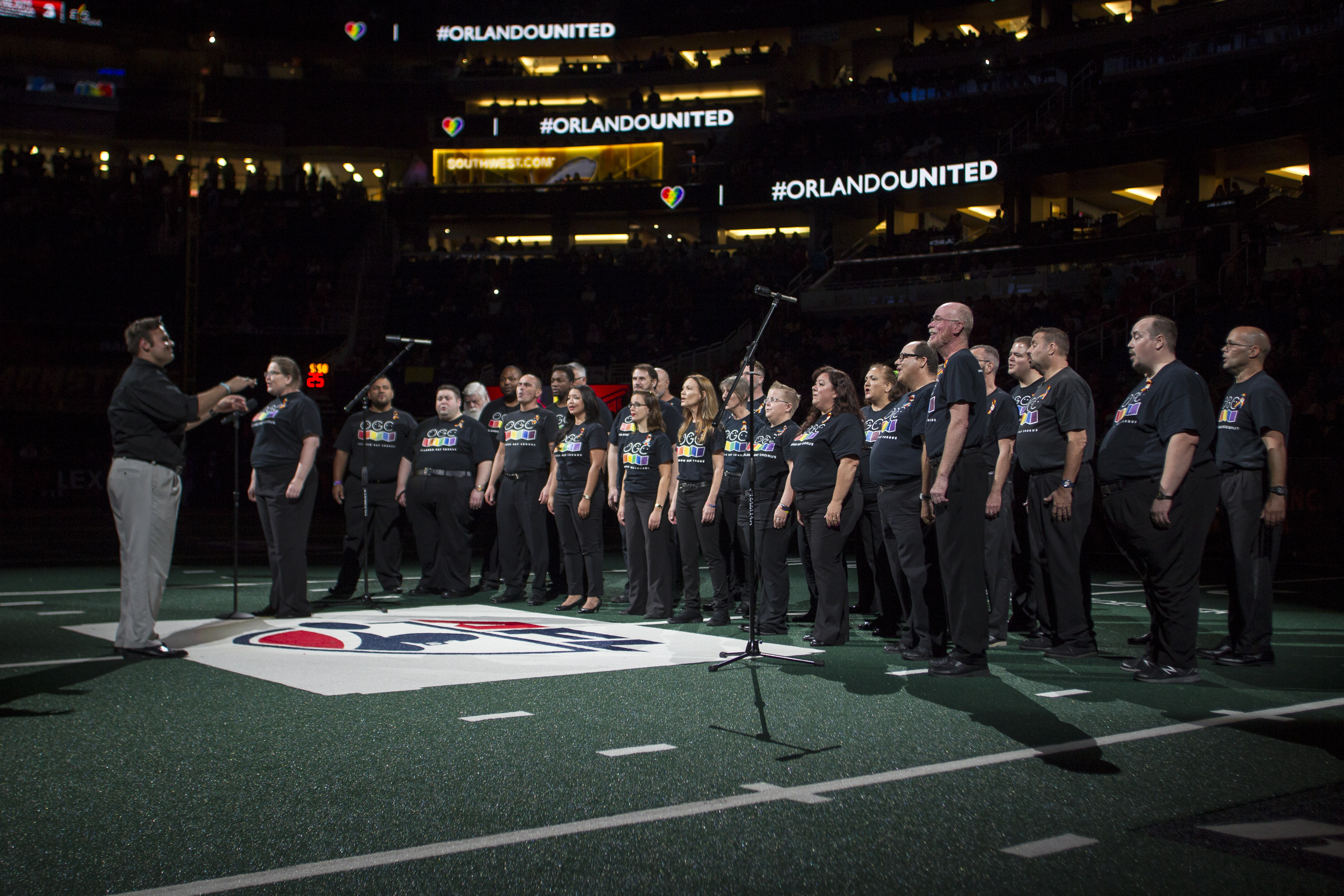 Choir singing in the middle of a stadium